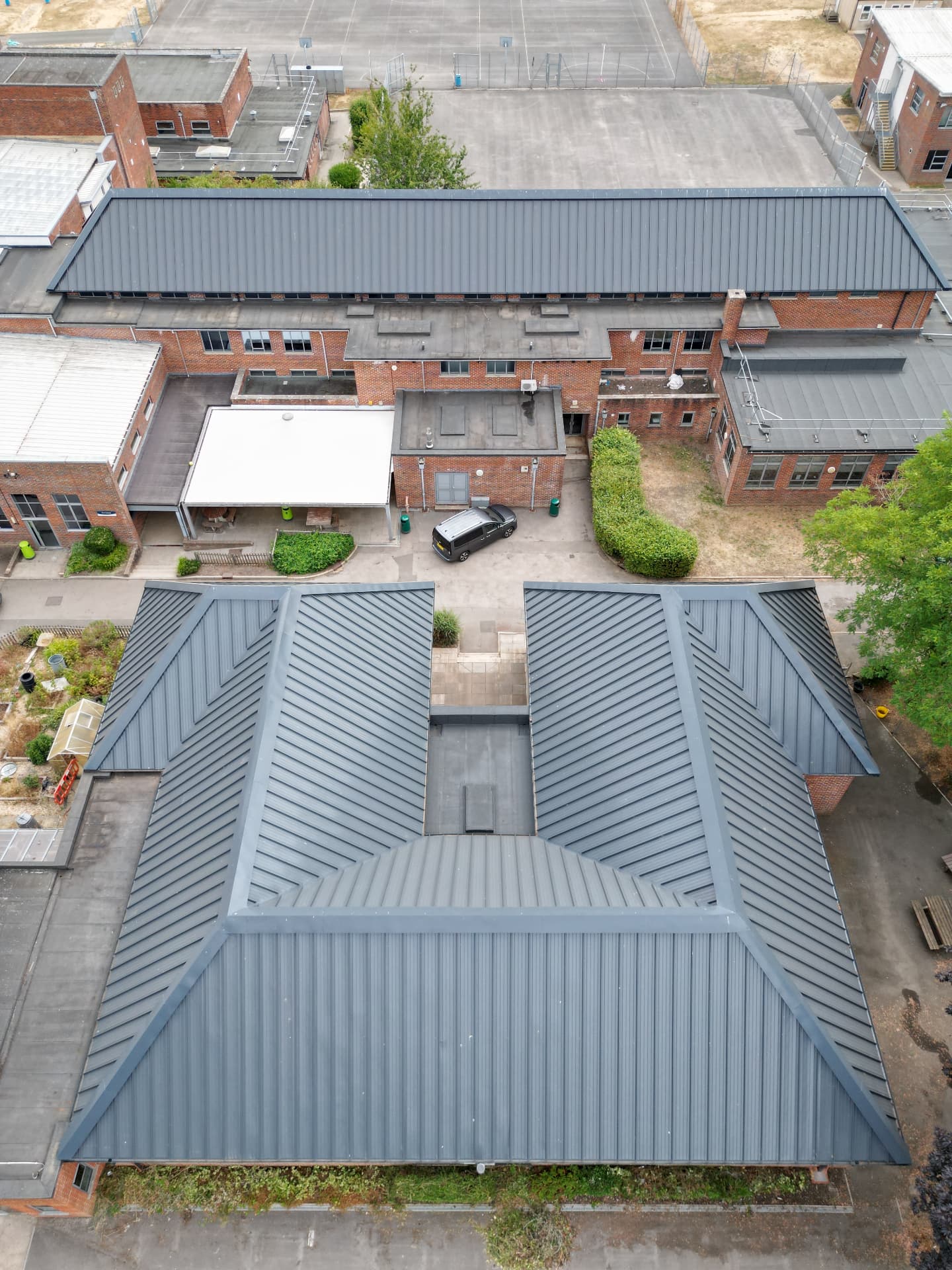 Second elevation of the U-shaped block with completed metal roof, Kingsbury Green Academy