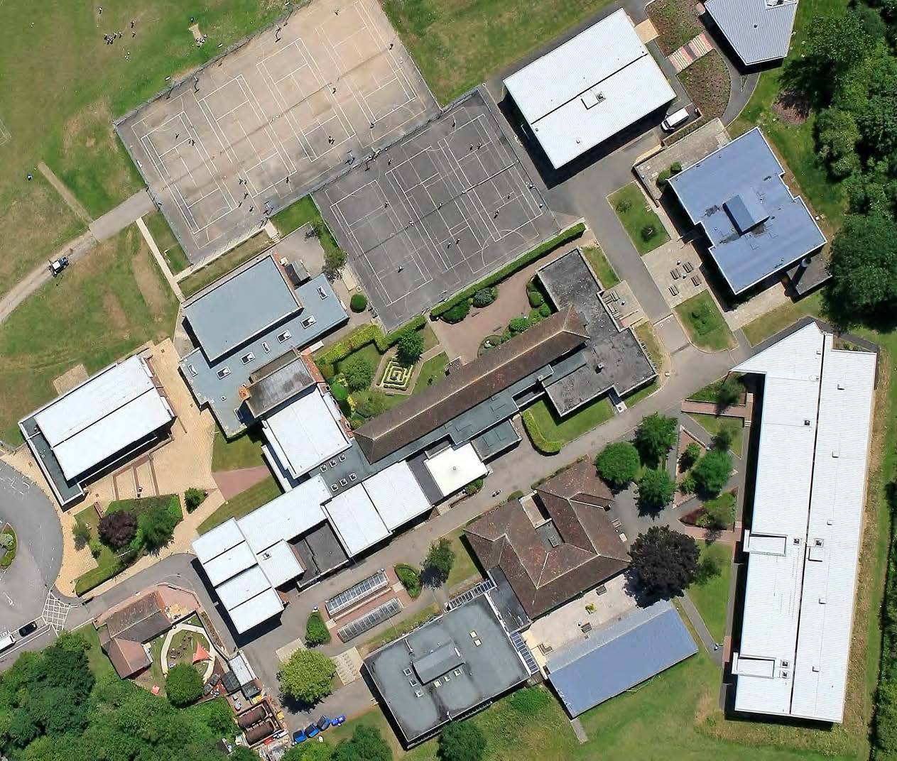 Aerial overview of the Kingsbury Green Academy campus roofs before replacement