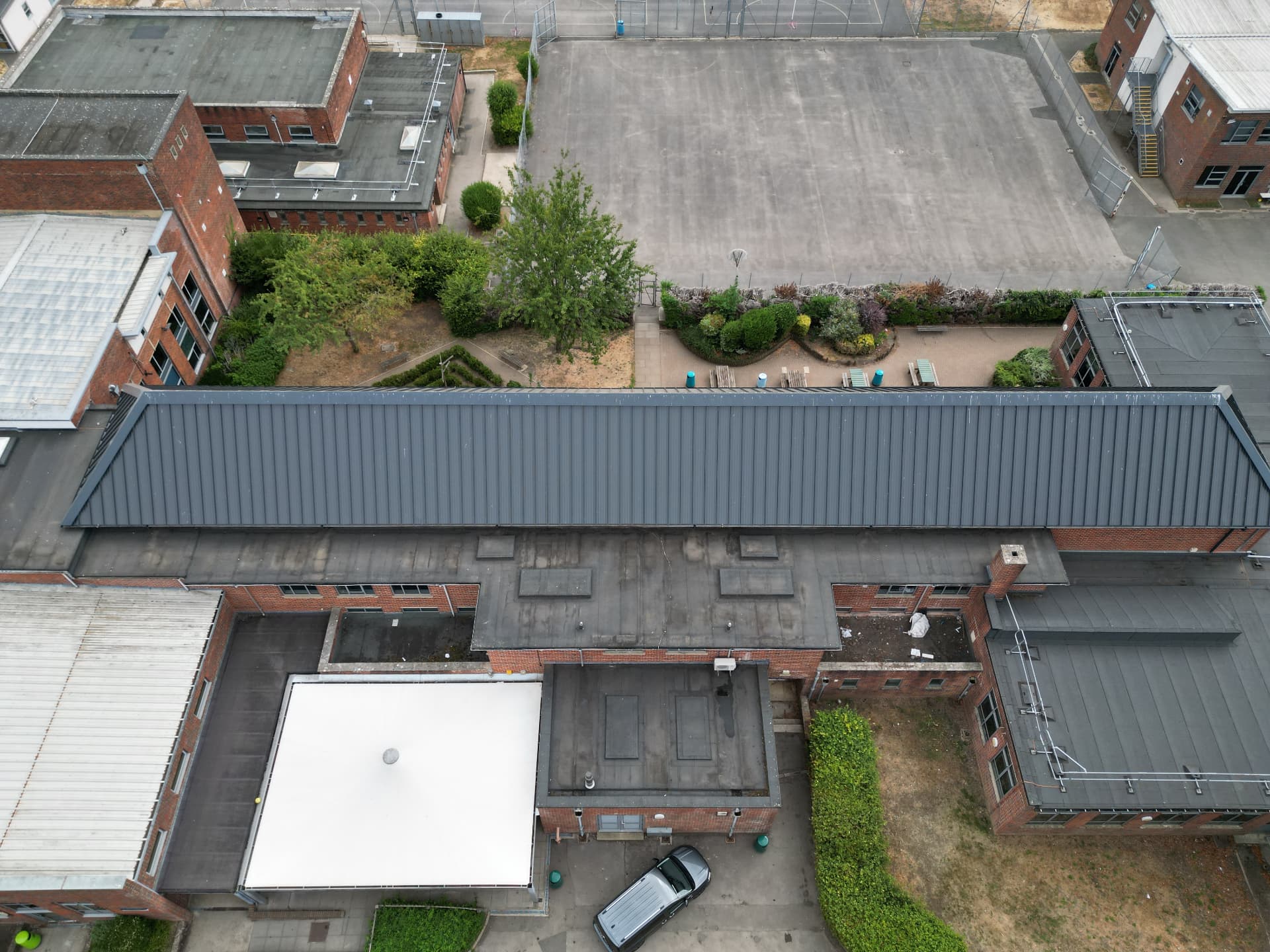 Long teaching block with completed metal roof covering, Kingsbury Green Academy