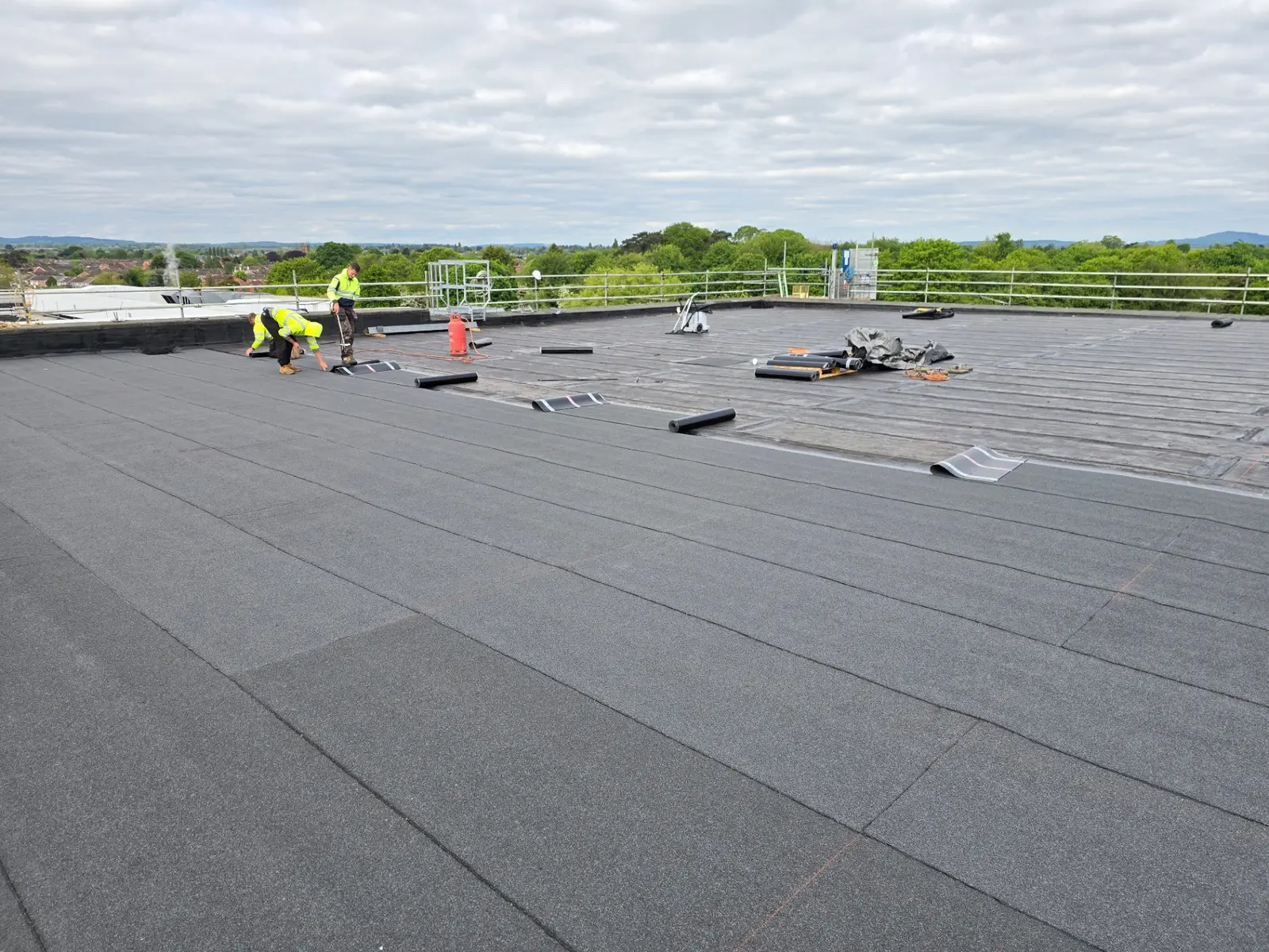 TRS operative carrying out planned maintenance on a commercial flat roof